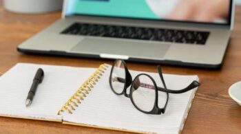 open-notebook-with-pen-and-eyeglasses.jpg.2.2x.generic